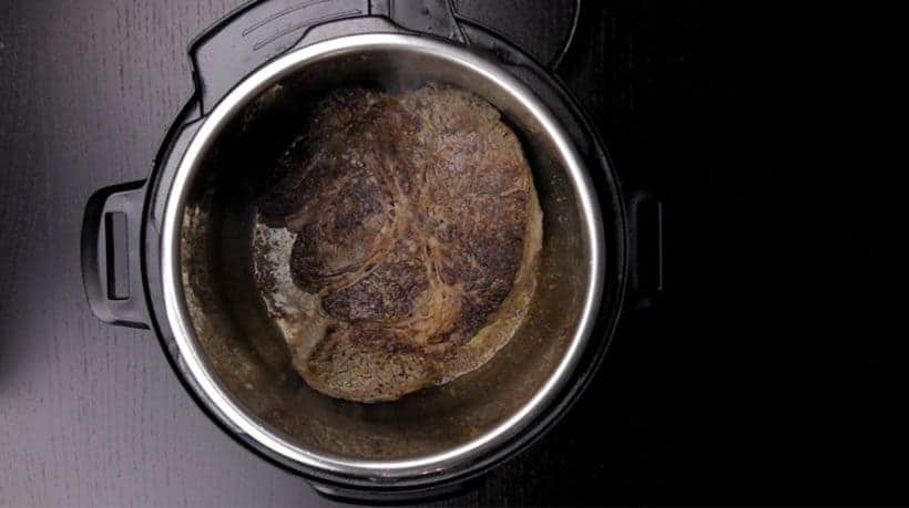Make Instant Pot Mississippi Pot Roast Recipe (Pressure Cooker Mississippi Pot Roast): brown chuck steak in Instant Pot Pressure Cooker