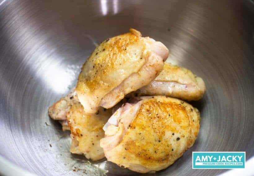Instant Pot Chicken and Dumplings Recipe (Pressure Cooker Chicken and Dumplings): chicken thighs browned in Instant Pot Electric Pressure Cooker with Saute More function