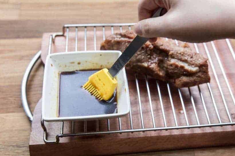 Instant Pot Char Siu Recipe (Pressure Cooker Char Siu): Basting the pork with honey sauce mixture
