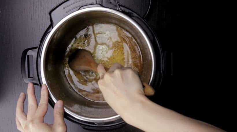 Make Instant Pot Mississippi Pot Roast Recipe (Pressure Cooker Mississippi Pot Roast): deglaze Instant Pot Pressure Cooker with wooden spoon