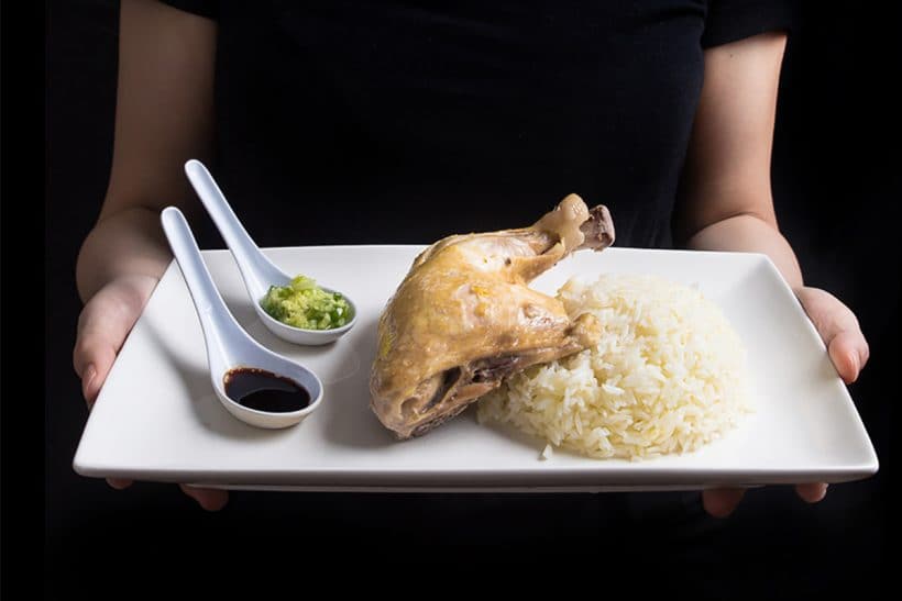 Make this easy Singaporean Hainanese Chicken Rice recipe! Dip the tender & moist Hainanese chicken into flavorful sauces with a spoonful of fragrant “oily rice”. Comforting chicken and rice meal with a homey soup. A simple complete meal with almost zero waste!
