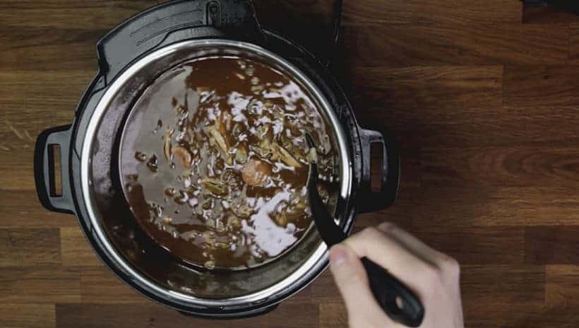 Instant Pot Gumbo Recipe (Pressure Cooker Gumbo): add shredded chicken thighs into gumbo in Instant Pot Electric Pressure Cooker. Taste and adjust seasoning.