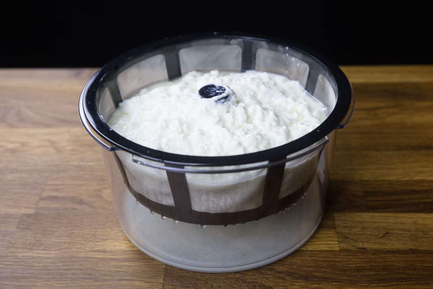 Foolproof Instant Pot Greek Yogurt Recipe #12 (Pressure Cooker Greek Yogurt): straining the yogurt with Greek Yogurt Maker to separate the whey from the yogurt