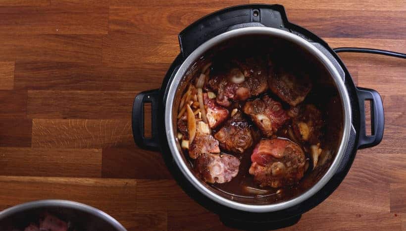 add browned oxtails in Instant Pot Pressure Cooker